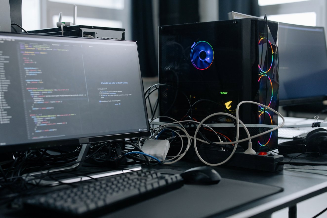 Black Computer Monitor and Keyboard